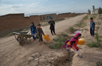 Afghan children doing chores while not in school