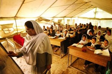Inside a tent classroom, courtesy of Amin Wahidi
